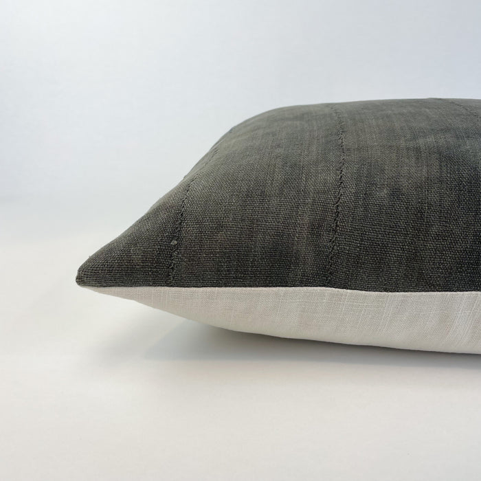 Charcoal mud cloth pillow cover. Front is made from authentic mud cloth, hand dyed in a rich charcoal hue. The back is an ecru cotton/linen blend. Measures 18" square. Insert not included.