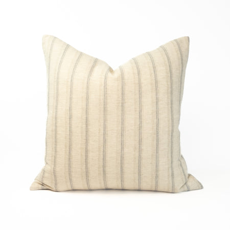 The Willow pillow cover is limited edition made from a hand woven hemp textile in a soft sand with khaki and blue stripe. A sophisticated layer of modern coastal decor. Measures 20" x 20". Insert not included.