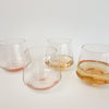 Rose' stemless glass.  Clear tinted blush glass in this modern silhouette makes it a favorite. Each sold separately.