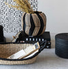 The Mali Seagrass Basket shown styled with other black and natural elements. Each item sold separately.