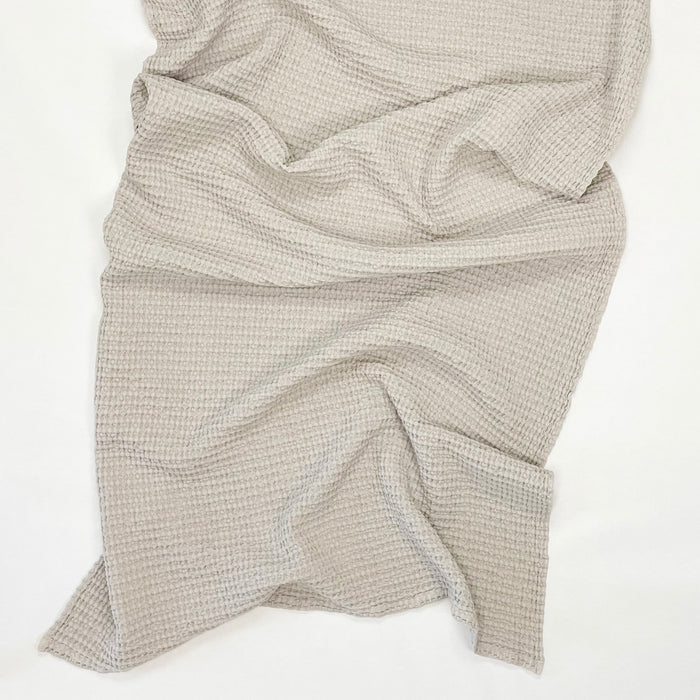 Simple waffle bath towel in light grey. Made in Portugal by Hawkins NY. 100% cotton waffle weave. 32 x 55 inches. 