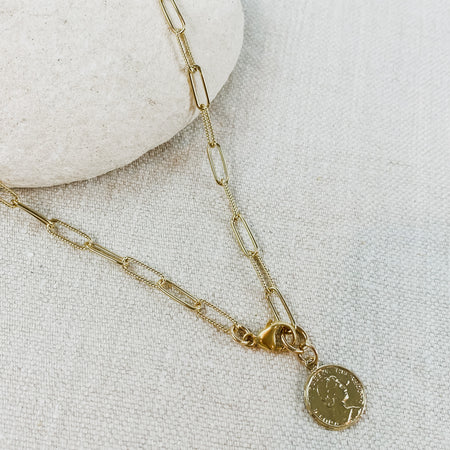 Gold chain link necklace with small vintage coin. Designed by Katie Waltman.