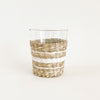 Hamptons Stripe Seagrass Tumbler. Tumbler is made of recycled glass and is wrapped in a hand woven seagrass frame in a chic stripe pattern. Dishwasher safe with seagrass frame removed. 