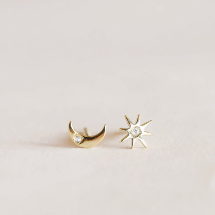 Moon + Sun earrings. The perfectly imperfect pair of complimentary earrings. Hand-crafted in 18 kt gold vermeil with a sterling silver base and finished with a single cubic zirconia stone.