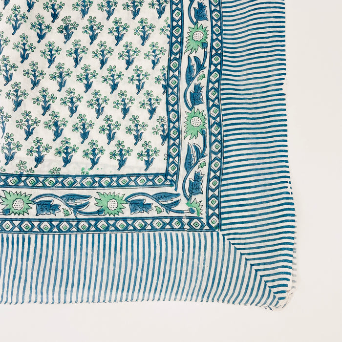 Blue + Green block print sarong from By the Sea Organics. Hand printed on 100% organic cotton. Use as a sarong, shawl or table covering. Measures 46" x 72"