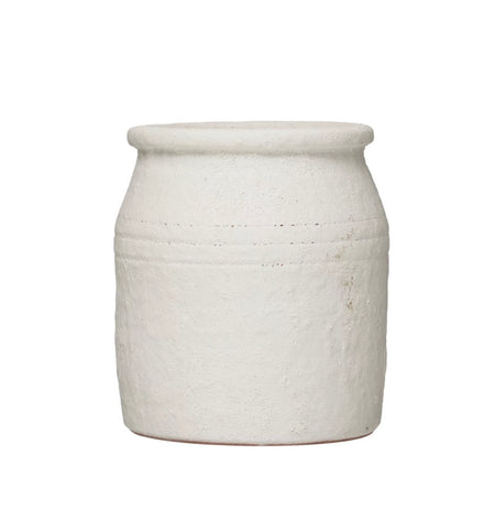 Mediterranean crock is hand crafted from terra cotta with a matte white lava stone finish. Mediterranean accent for the coastal or modern kitchen. Measures 7"H x 6.25" diameter. Ideal for holding kitchen utensils.