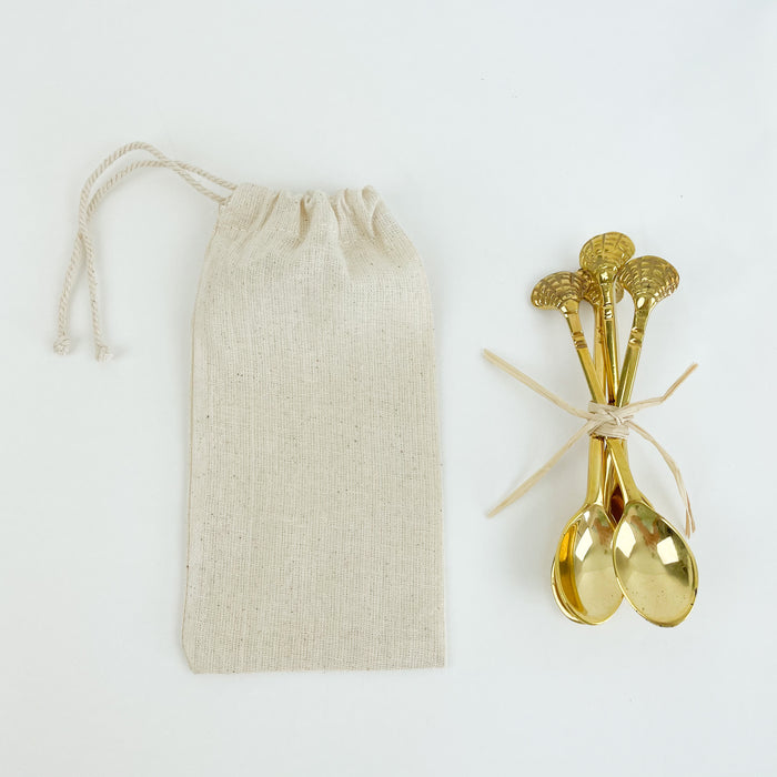 Brass spoons with brass shell handle. Perfect size to serve dips and jams or use with a cup of tea. Set of 4 comes in a drawstring cotton bag. Makes a great hostess gift. Measures 4.74"L. Hand wash only.