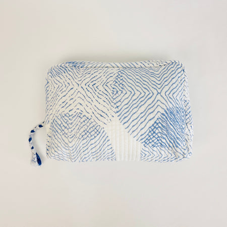 Travel Pouch in "waves" print from By the Sea Organics. Made of soft quilted organic cotton. 10" x 7"