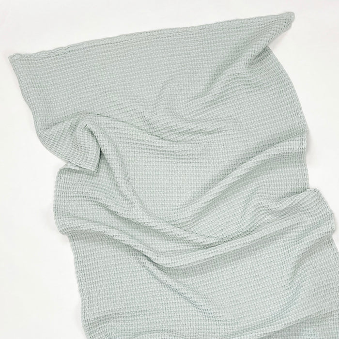Simple waffle weave bath towel in sky blue. Made by Hawkins NY in Portugal. Luxurious 100% cotton waffle weave stonewashed for added softness.  32 x 55 inches