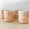 Golden Rainbow Ceramic Tumblers. Small cup with blush pink glaze and hand painted gold rainbow. Each sold separately.