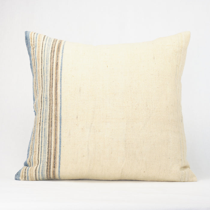 Cream pillow with blue, tan and brown multistripe border