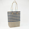 Blue and natural stripe tote bag made from recycled grain bags in Morocco.