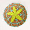 Artisan basket with yellow and aqua star pattern by Indego Africa