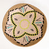 African plateau basket with natural, pink, aqua and yellow design
