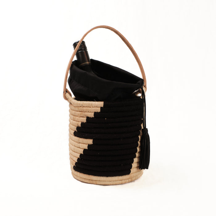 Raffia basket tote in natural and black. Show holding a bottle-not included.