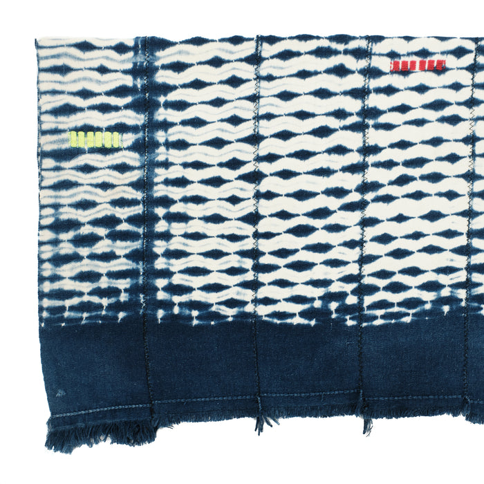 Indigo and white shibori cotton throw. Wide band of indigo in each end. Panels are zig zag stitched together.