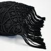 Crocheted throw pillow in black cotton yarn with fringe trim