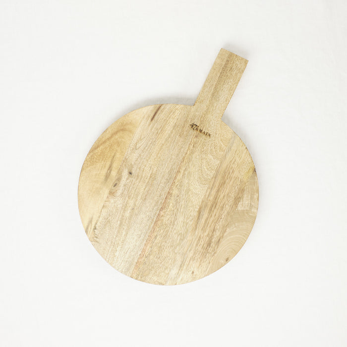 Large round wood serving board. Pale wood with waxed finish.
