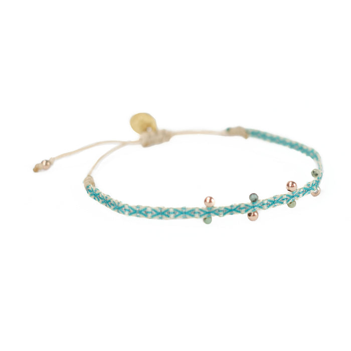 Aqua-Green woven friendship bracelet embellished with jade and gold plated beads. Adjustable waxed cord closure.