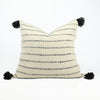 Pillow made of soft natural wool in cream with black stripes and black poms by Treko Wool.