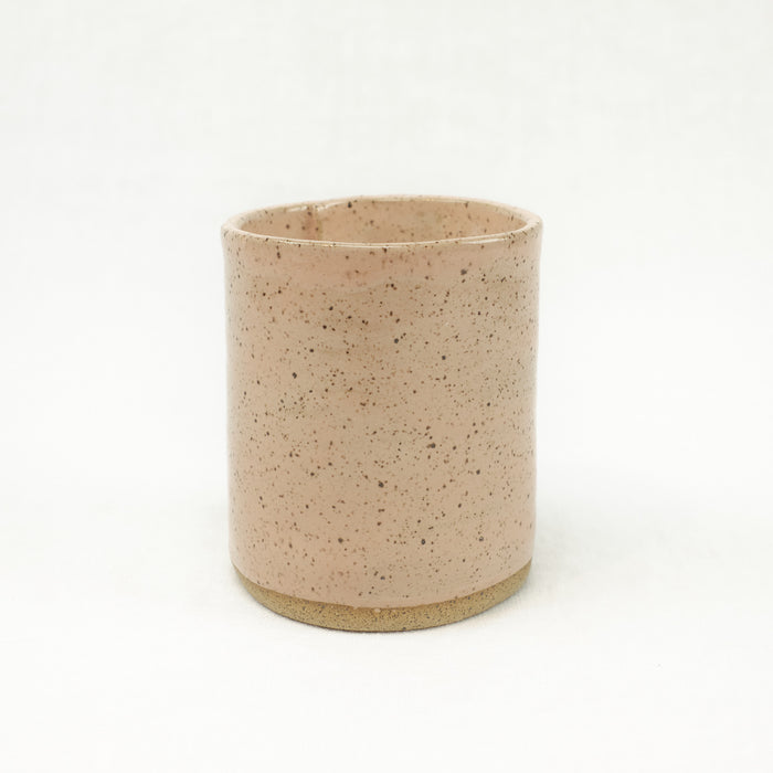 Cedar scented soy candle in a blush pink ceramic vessel. Made by Catherine Rising.
