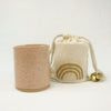 Cedar scented soy candle in a blush ceramic vessel by Catherine Rising. Comes wrapped in  a muslin bag.