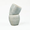 Stack of two small blue-grey ceramic cups by Totem Home.