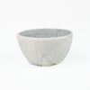 Blue-grey ceramic bowl by Totem Home.