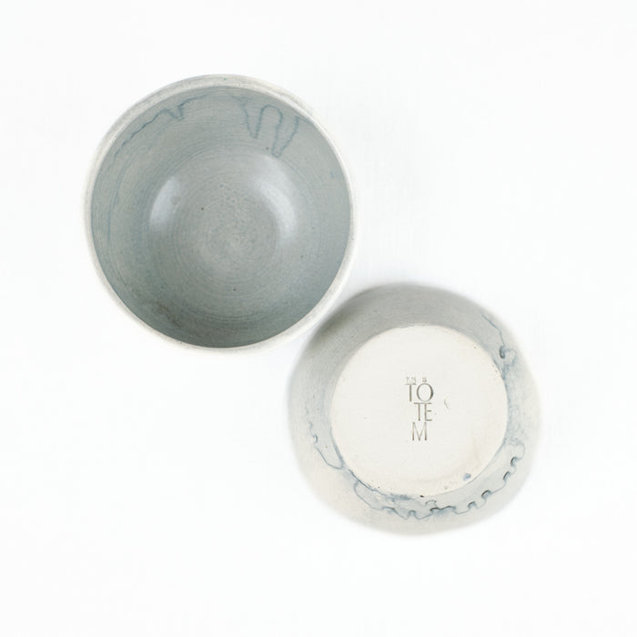 Top and bottom view of ceramic bowl with Totem Home stamped on bottom
