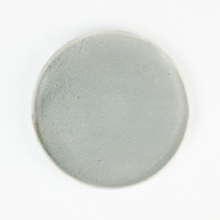 Small side plate by Totem Home. Hand made ceramic in a blue-grey glaze.