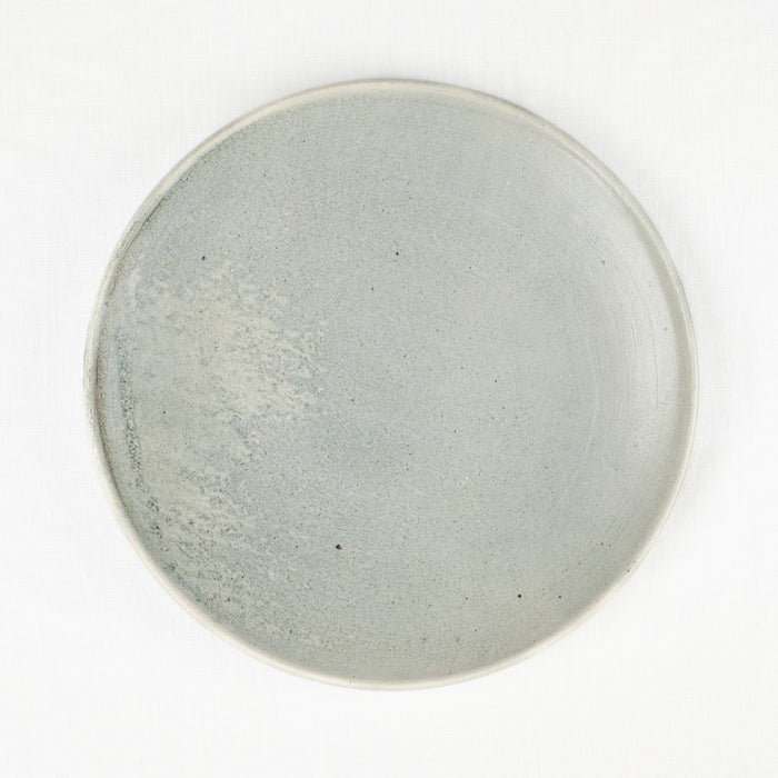 Blue-grey ceramic dinner plate by Totem Home.