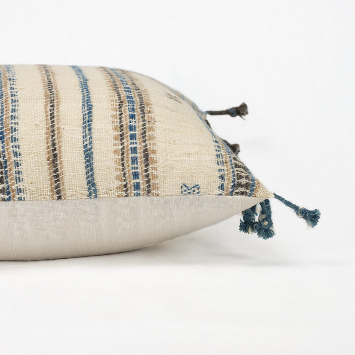 Artisan pillow in cream wool with blue, tan and brown blanket fringe trim