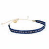 Azure 1 woven friendship bracelet in a rich cobalt blue with fine gold embroidery. Pull string adjuster, one size fits most. 