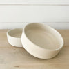 Pair of  Mesa stoneware bowls, each sold separately. Small batch stoneware made in Portugal. Modern silhouette finished in a creamy matte glaze perfect for the modern bohemian table. 6.25" diameter 1.75" high.