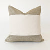 Square Hamptons pillow color blocked in tan and cream linen with hand whipstitching at the seams. 20 x 20 inch.