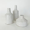 Collection of 3 white Mediterranean Vessels. Size medium, tall and wide shown, each sold separately. Organic ceramic vases finished with thick, white, glossy glaze.