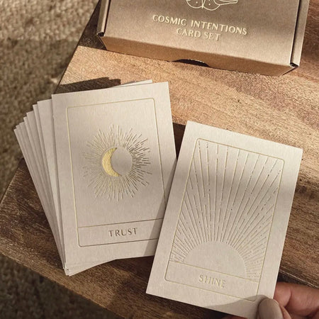 Cosmic intentions card set. Set of 18 cards come in a Kraft box with gold foil embossed printing. Each card has a unique symbol and intention meant to inspire. Approximately 3" x 4".