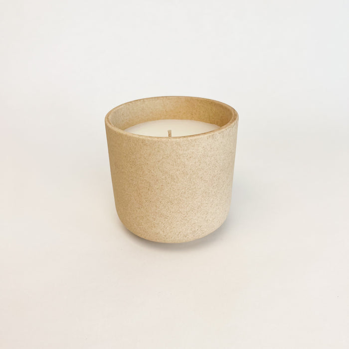 Candle with the fresh scent of eucalyptus and comforting notes of sage, juniper and amber. Hand poured in a natural stoneware vessel. Small: 13 oz. measures 3.75"H x 3.75" diameter.