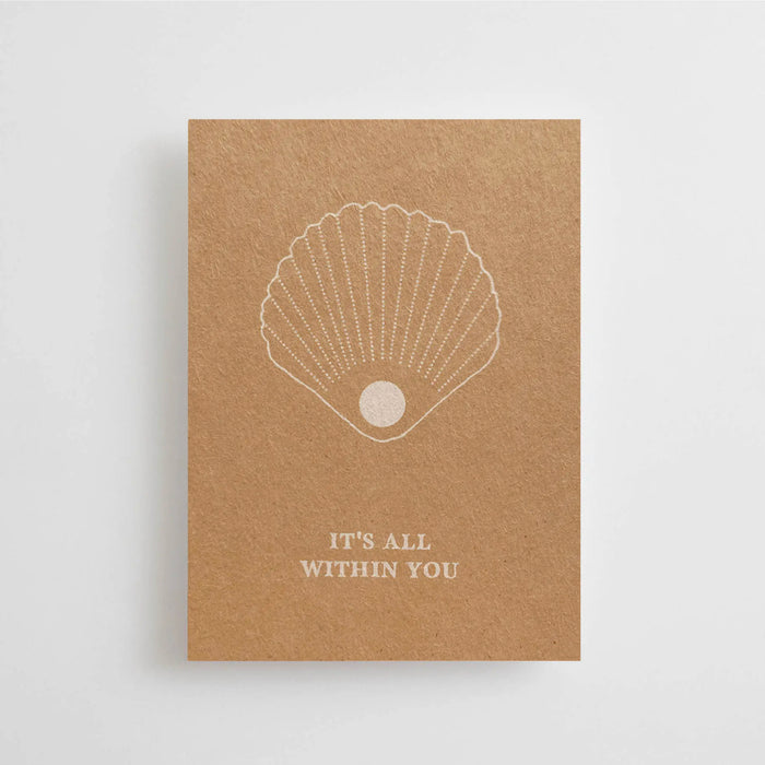 Mini postcard with message of  "It's All Within You" with line drawing of a shell and pearl printed on natural Finn board. Back left blank for note writing. 2.875" x 4.125" 