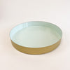 Medium Laguna brass tray with glossy sea mist enamel interior. Medium measures 14" diameter, 2" height. Coordinates with the small and large Laguna trays, each sold separately.