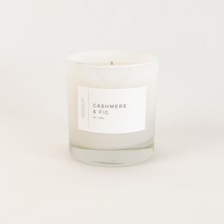 Cashmere & Fig candle by Lightwell & Co. Hand poured candle with the fragrance of fresh fig, white cedarwood and cashmere musk. 55 hour burn time.