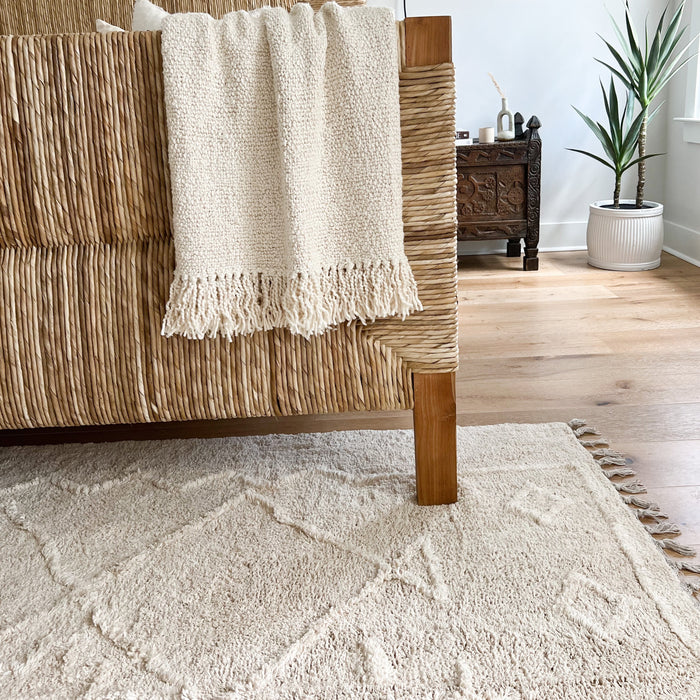 Berber style Ojai rug in shades of cream and sand with hand knotted fringe. Perfect for the luxe bohemian home. 5' x 7'