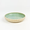 Momo dish in the seafoam glaze. Hand crafted stoneware by Tamiko Claire studio in Hawaii. Measures 6.25"diameter 1" height.