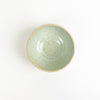 Chibiko bowl in surf mist glaze. Coastal inspired stoneware hand crafted in Hawaii by Tamiko Claire Studio. Its small proportions make it ideal for a serving of gelato or fresh berries. Measures 4" diameter 2.5" height.