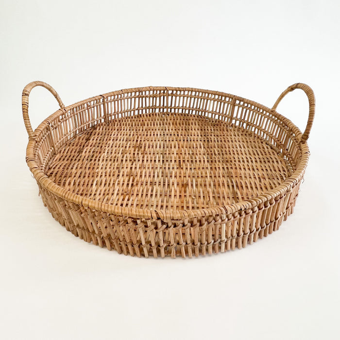 Large Roundhill tray is hand woven using natural rattan. The large measures 17" diameter 2.75" height. The large tray coordinates with the medium tray and can be nested together for a stylish display. Each sold separately.