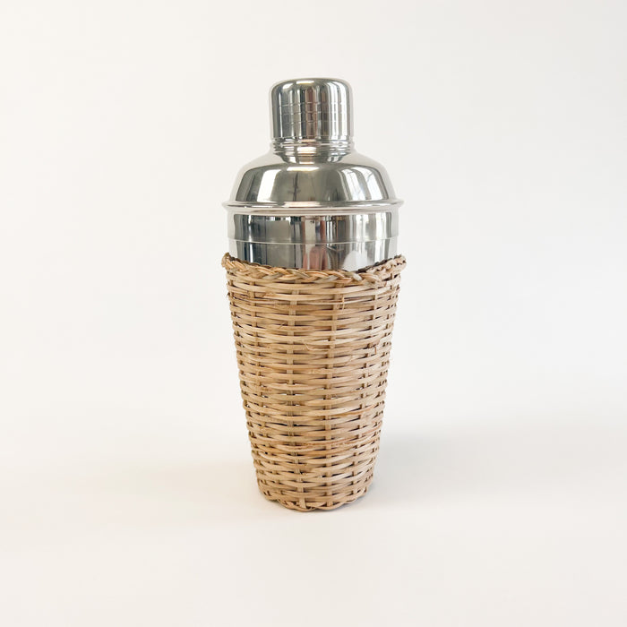 The Rattan cocktail shaker is made in stainless steel and wrapped in a hand woven rattan sleeve. A warm weather entertaining favorite. Measures 8" high 3.5" diameter.