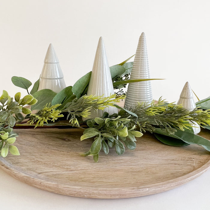 Stoneware mini trees shown with faux Eucalyptus and Evergreen stems. Natural holiday decor. Trees and greenery sold separately.