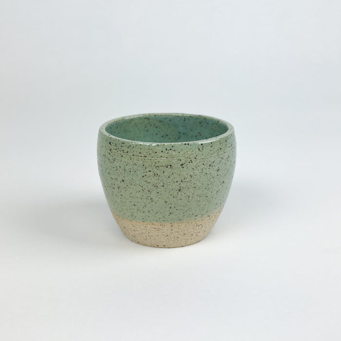 Chibiko cup in the seafoam glaze. Coastal inspired ceramics hand crafted by Tamiko Claire Studio in Hawaii. Its petite proportion makes it perfect for espresso or a small pour of wine. Measures 2.5" diameter 2.5" height.