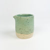 Chibiko Carafe in the seafoam glaze. Hand crafted stoneware by Tamiko Claire Studio in Hawaii. The petite proportions are perfect as a personal serving of syrup or cream. Measures 3.5" height 3" diameter.