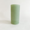 Ribbed pillar candle in holly green with powdered finish. 3" x 6" unscented candle. 85 hour burn time. Holiday decor.